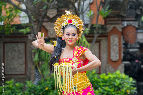 Asian dancer performs Pendet dances at outdoor photo