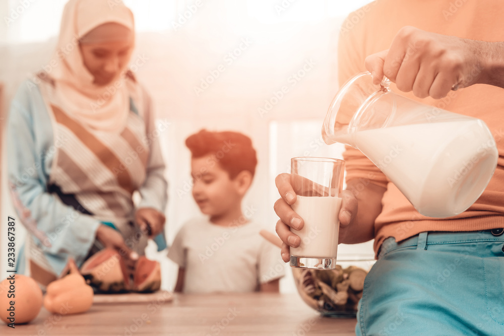 Happy Arabian Family Eating Watermelon in Kitchen. Happy Arabian Family Eating Watermelon in Kitchen.
