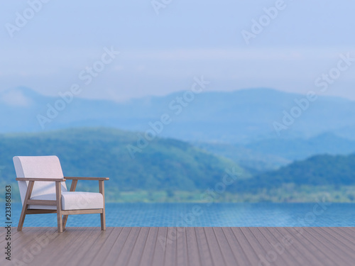 Swimming pool terrace with blurry mountain view background 3d render, There are wood floor.Furnished with white fabric chair,Focus on the chair,The picture is blue tones like the evening time. © onzon