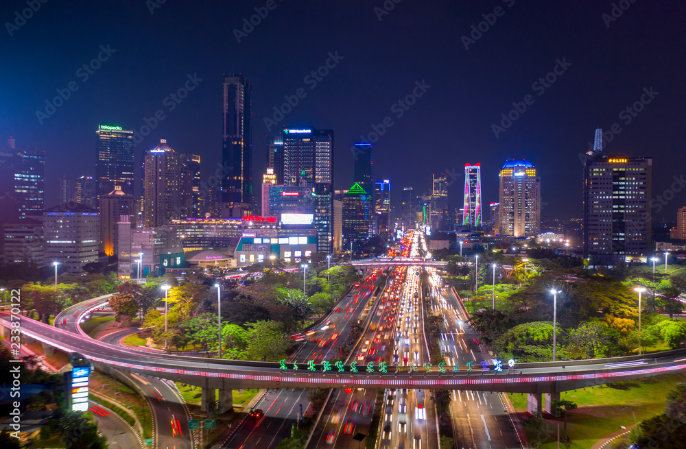 Fototapeta premium Hectic traffic along the Sudirman highway at night