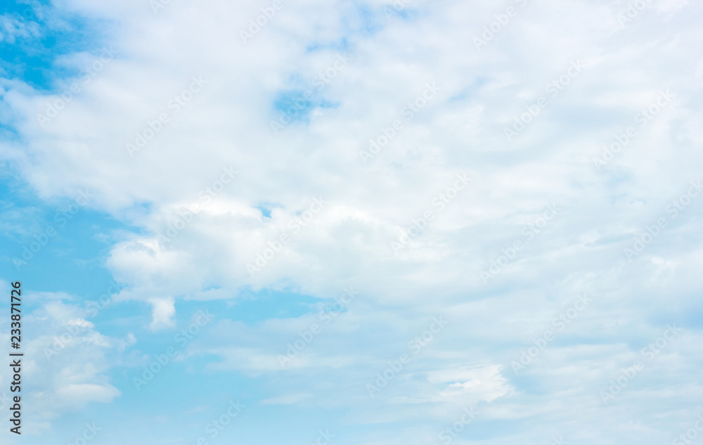 Beautiful blue azure sky with white clouds on sunny day, background, copy space for your design or concept