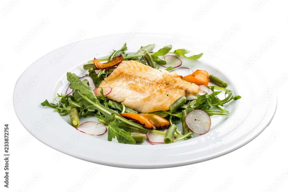 Fried bass with salad. On a white background Fried bass with salad. On a white background
