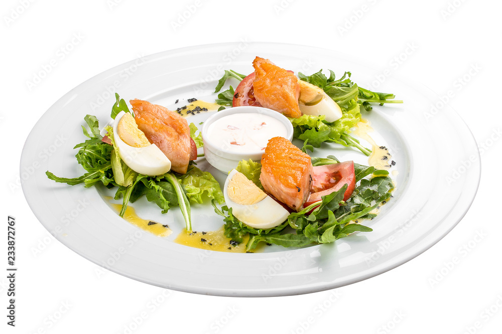 Salad with baked salmon in olive oil with tomatoes and egg Salad with baked salmon in olive oil with tomatoes and egg