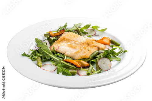 Fried bass with salad. On a white background