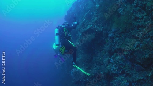 scube diver take pictures liberty wreck tulamben indonesia bali  photo