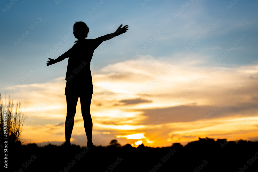 young woman warming up outdoors at park