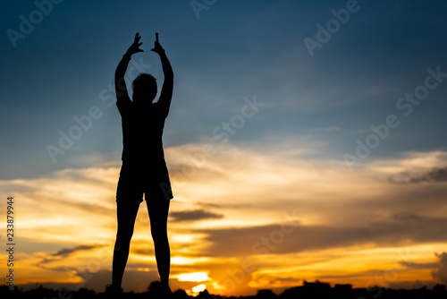 young woman warming up outdoors at park