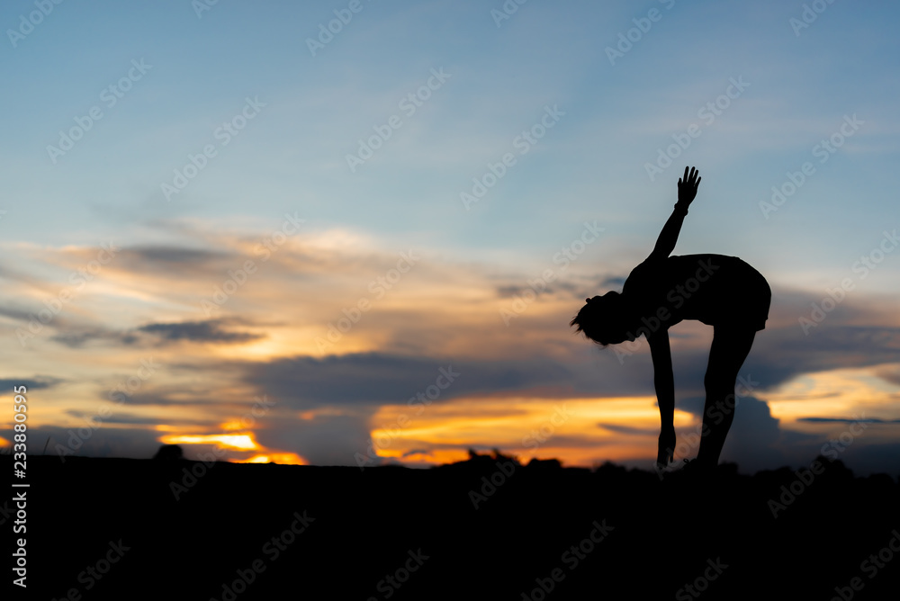 young woman warming up outdoors at park