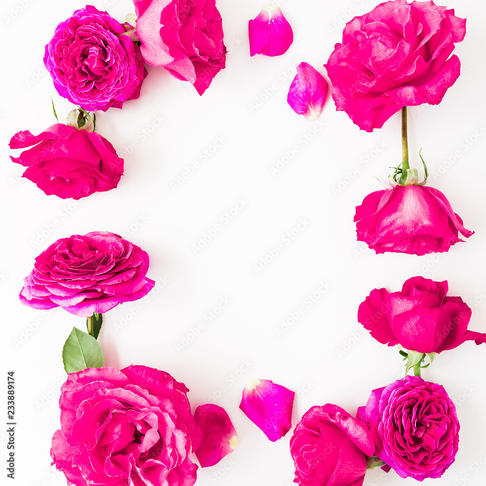 Floral frame of pink roses, petals and peonies on white background. Flat lay, Top view. Flowers texture.