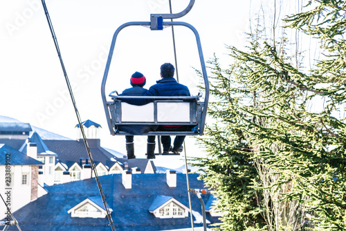 Cable car with two people going up on funicular in Sierra Nevada mountains
