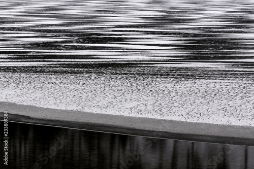 Wintry compositions and forms in the Lago di Cave del Predil lake, Tarvisio, Julian Alps, Udine, Italy