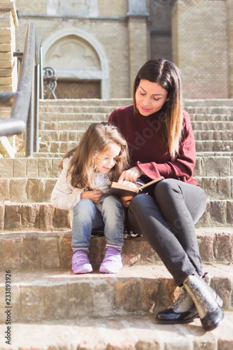 My daughter adores when I read stories in front of the church on Sunday