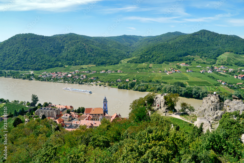 Durnstein, Wachau, Austria. View of the village from the top, with the Burgruine Dürnstein in the foreground and the Danube in the background.