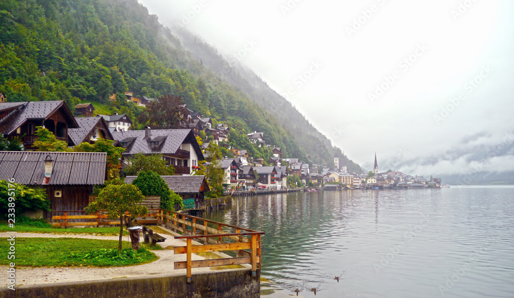 Hallstatt, Salzkammergut, Upper Austria. View over the town and the lake in a foggy day from the South.