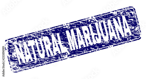 NATURAL MARIJUANA stamp seal imprint with distress texture. Seal shape is a rounded rectangle with frame. Blue vector rubber print of NATURAL MARIJUANA tag with dust texture.