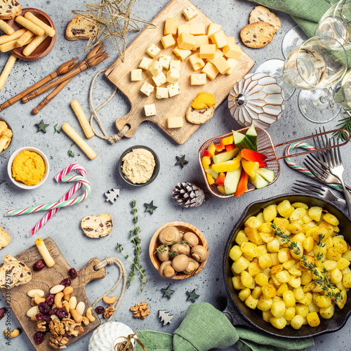 Festive flat lay with christmas dinner party table, holiday vegeterian food concept background, top view