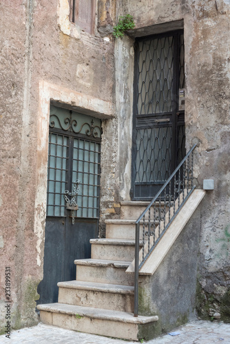 Porch in an Italian old house. The architecture of the building.