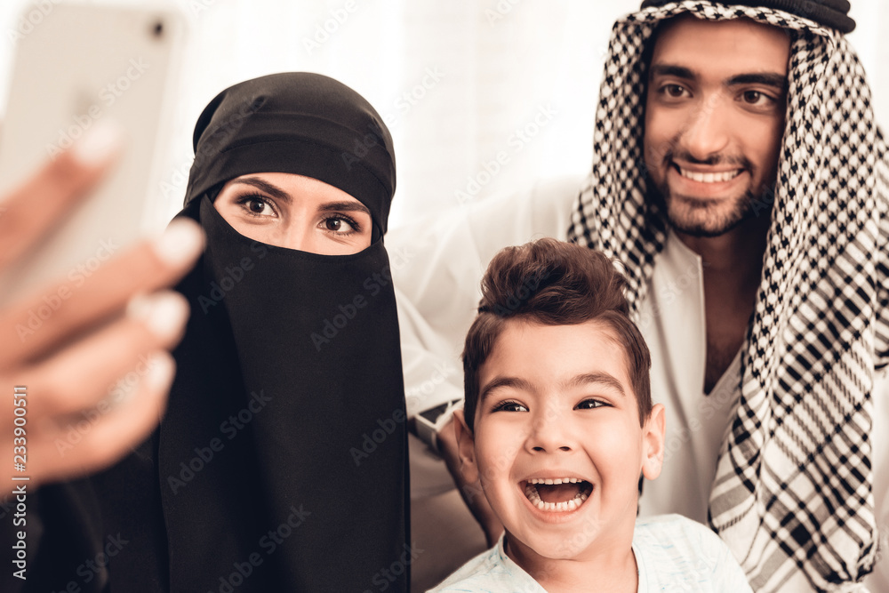 Happy Young Arabian Family Taking Selfie at Home. Happy Young Arabian Family Taking Selfie at Home.