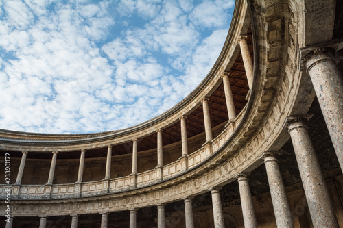 Columns of the main courtyard of Charles V Palace, part of the Alhambra complex, Granada, Spain photo
