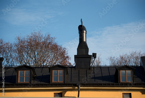 Old chimney on a roof in Stockholm