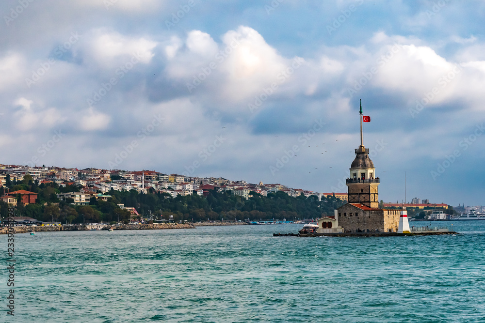 Maiden's Tower in Istanbul, Turkey with cityscape and blue clouds in the background