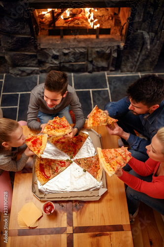 Top view of happy family eating pizza