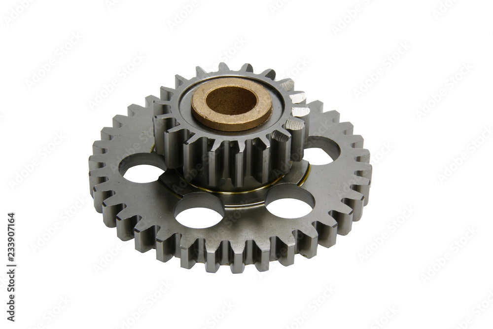 Metal gears isolated above white background. Car parts on white background. Metal gears isolated above white background. Car parts on white background.