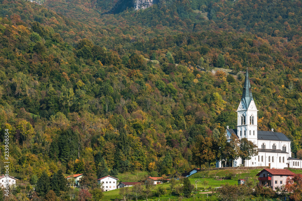 Picturesque church on hill top in Dreznica, SLovenia at autumn