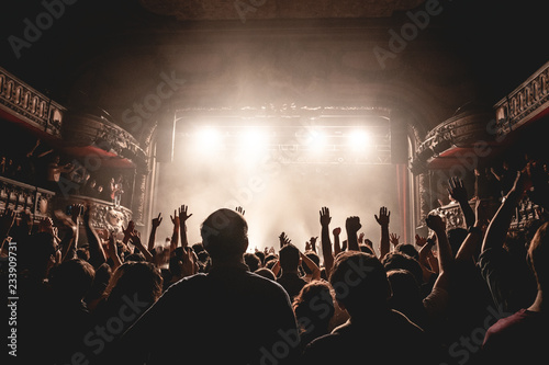People dance on music in nightclub photo