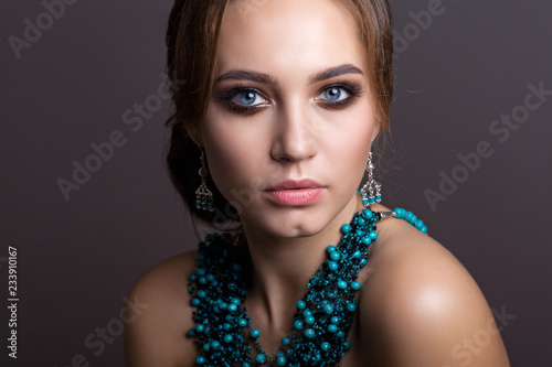 Portrait of a beautiful woman with beautiful make-up and hairstyle.