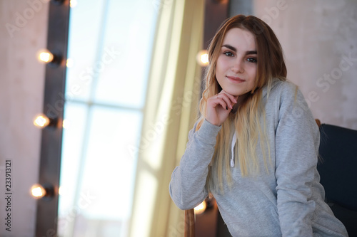 A young girl rests in a cozy room