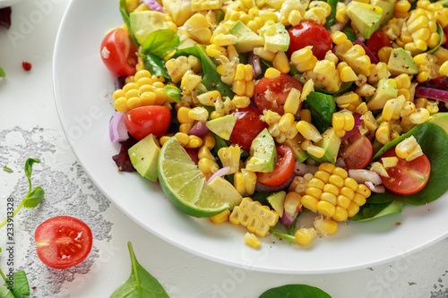 Sweet Corn salad with tomatoes, avocado, red onion, herbs and lime