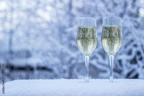 glass of champagne on on winter background