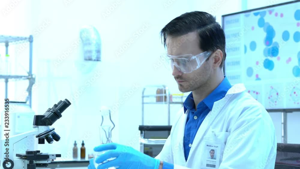 Scientists are experimenting with chemicals compound and absorb liquid the test tube. Concept of science, testing development and lab industry. Scientists are experimenting with chemicals compound and absorb liquid the test tube. Concept of science, testing development and lab industry.