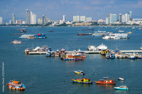 The view of the scenery is filled with the beauty of the sea, the sky and many ships that park in the bay and the city.