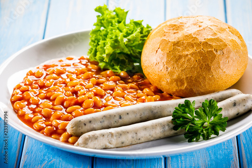 English breakfast - bun,sausages and beans photo
