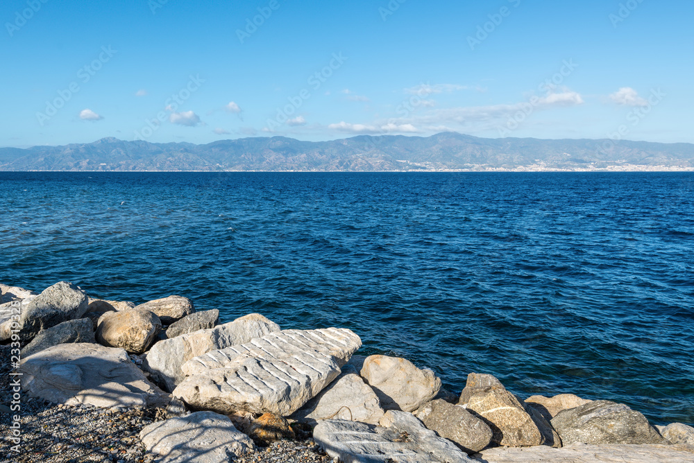 View of Strait of Messina connected Mediterranean and Tyrrhenian sea and Sicilia island background, Reggio Calabria, Southern Italy
