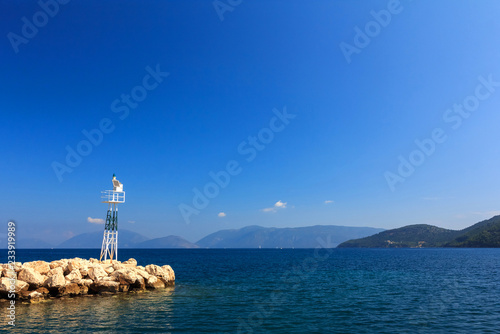 Little lighthouse in harbour. Kefalonia, Greece