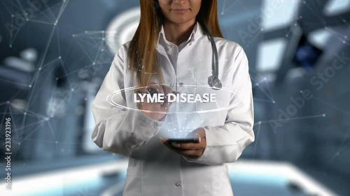 Female Doctor Hologram Word Lyme disease photo