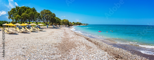 View of Soroni beach with umbrellas and sun beds - PANORAMA (Rhodes, Greece)