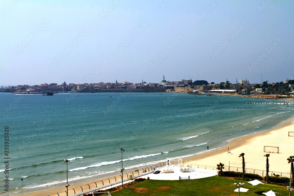 Panoramic view of the city walls, the fishing harbor, and the old city skyline, in Acre (Akko), Israel