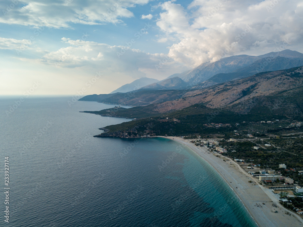 Aerial view of Livadhi Beach, Albania. Beautiful beach in the Mediterranean, Albanian Riviera in Himara Aerial view of Livadhi Beach, Albania. Beautiful beach in the Mediterranean, Albanian Riviera in Himara