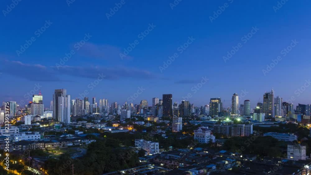 Zoom out Bangkok skyline time-lapse morning transition from dark to sunrise then blue sky day of downtown and city panoramic skyline along Sukhumvit Road. 16:9 4k at 30fps Zoom out Bangkok skyline time-lapse morning transition from dark to sunrise then blue sky day of downtown and city panoramic skyline along Sukhumvit Road. 16:9 4k at 30fps