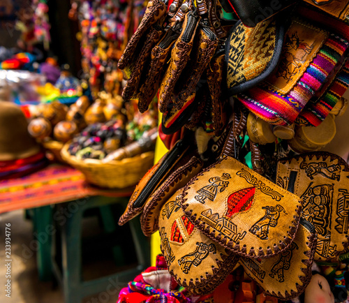 Different leather and fabric handbags on the souvenir store in Bolivia
