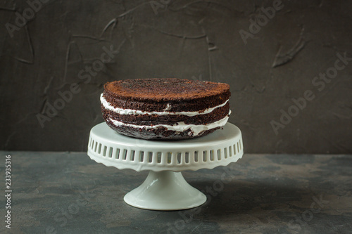 chocolate cake with pomegranate and rosemary (the cake is creamy with chocolate). top view.