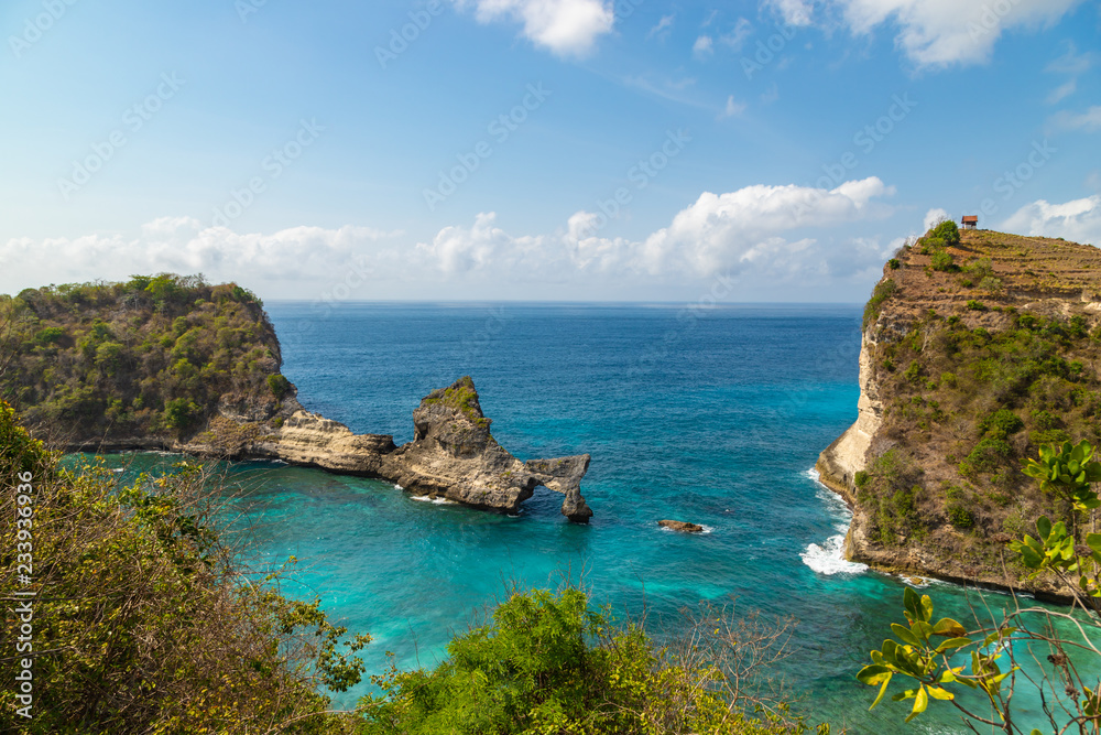 Atuh beach with sea rocks and blue sky at Nusa penida island near Bali. Turquoise ocean landscape, Indonesia