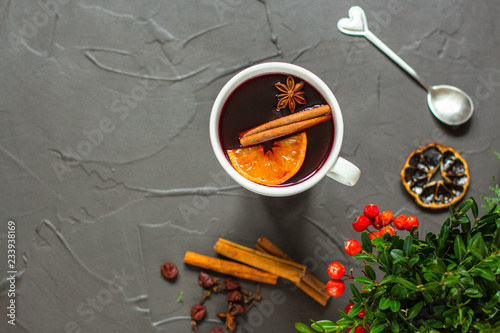 Mulled wine with spices and gifts on the table. Happy New Year! Top view