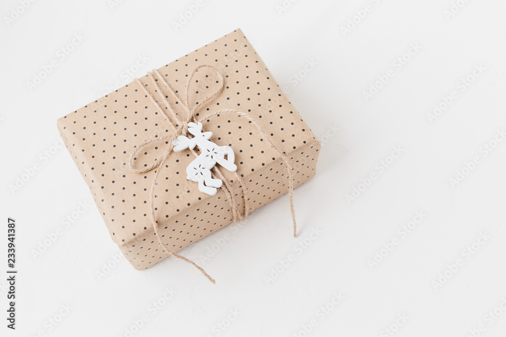 Wrapped present on textured white background Wrapped present on textured white background