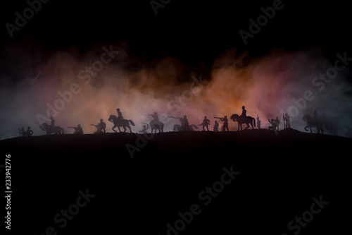 American Civil War Concept. Military silhouettes fighting scene on war fog sky background. Attack scene. photo