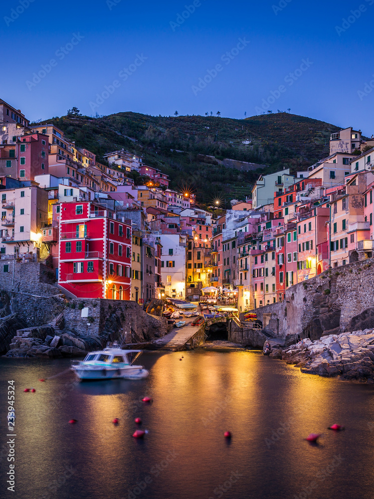 Night view of Riomaggiore. It is the most southern village of the five Cinque Terre towns. Liguria, Italy.